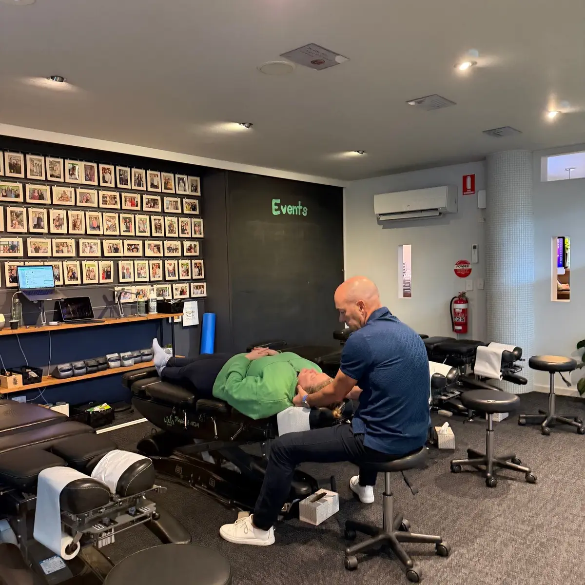 Dr Damian adjusting a patient's neck