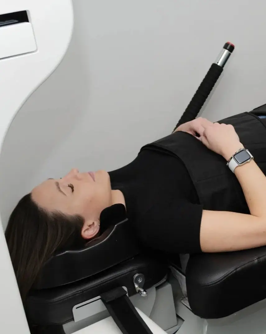 A patient on the spinal decompression bed